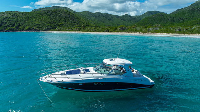 TITO 2 anchored off a beach in Antigua